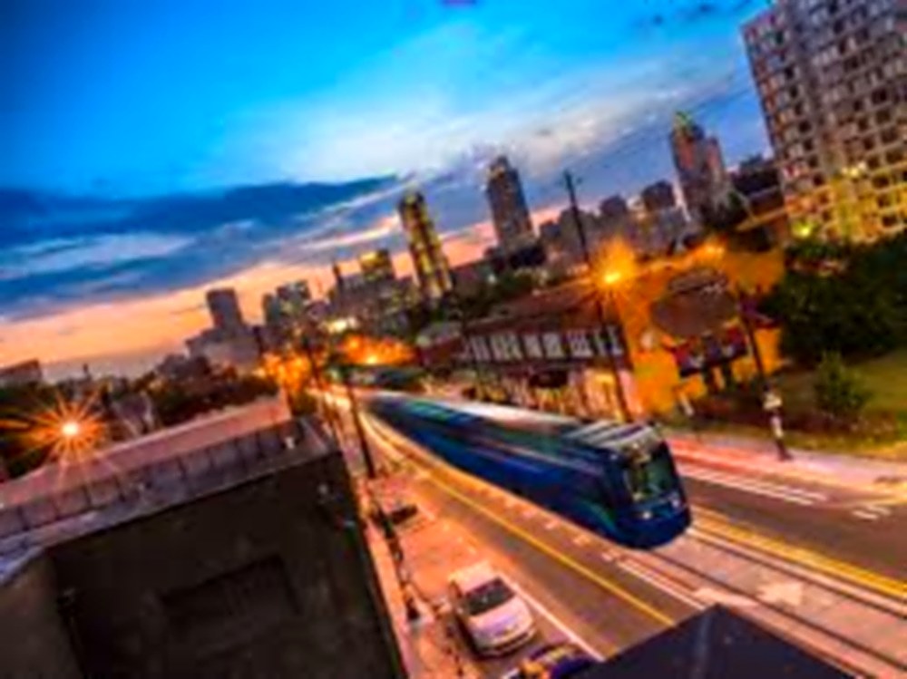 Atlanta streetcar and skyline at dusk